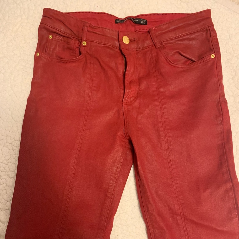 Waxed red jeans